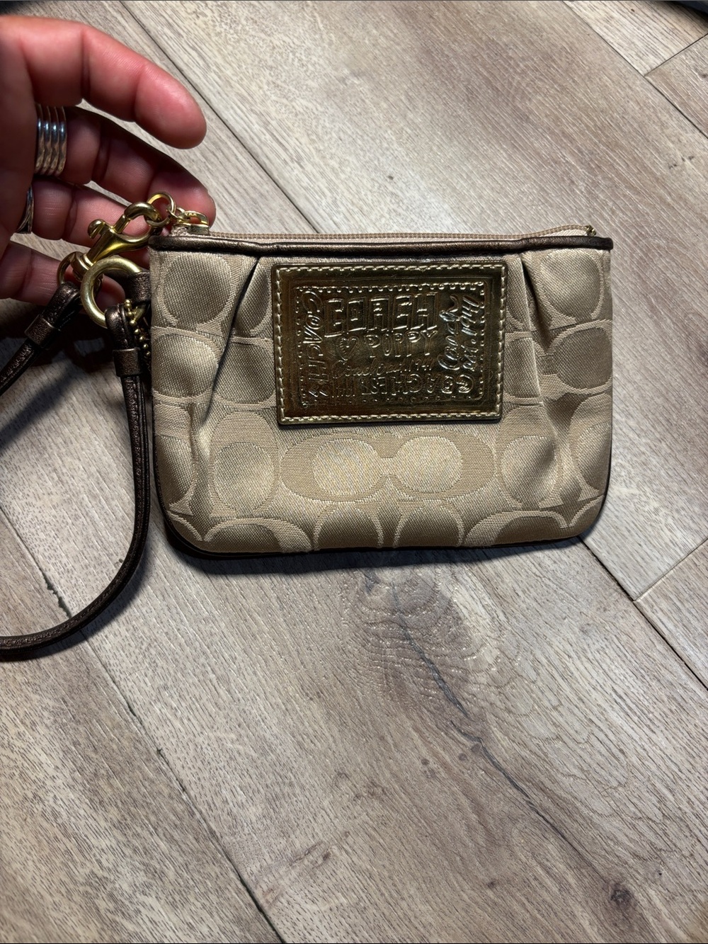 Coach Tan Signature Wristlet with Gold Plaque
